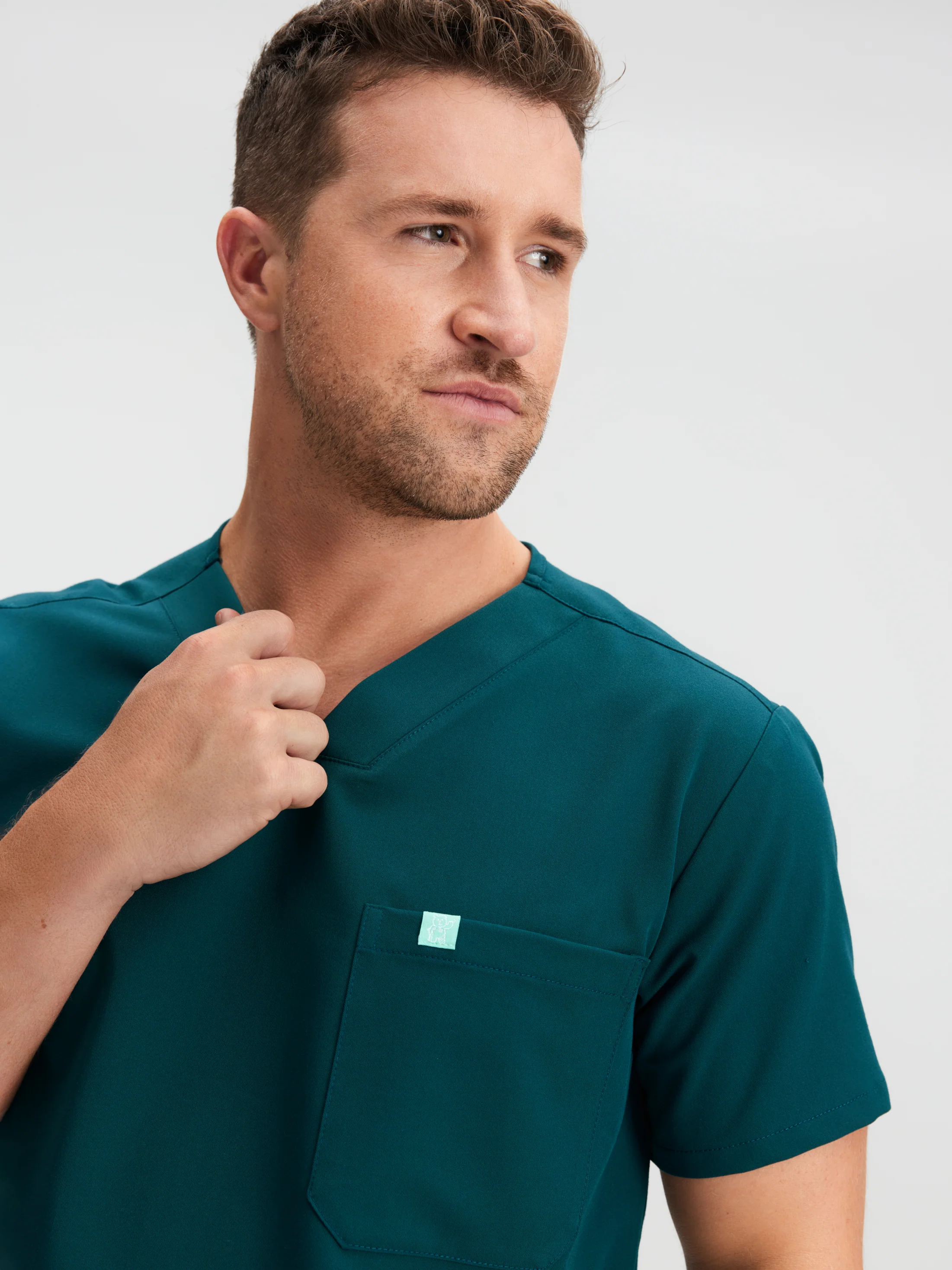 LOGAN With AOGQ EMBROIDERY - TEAL - One Pocket Men's Scrub Top - SILVADUR™ - Image 3